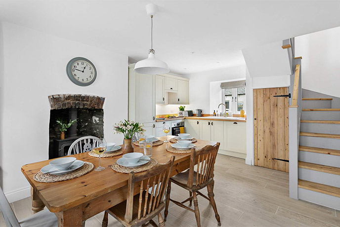 The cosy dining room and kitchen at Cadena Cottage