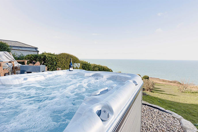 Looking out at beautiful sea views from a hot tub