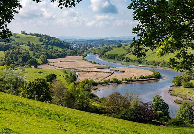 The winding River Dart with countryside and Totnes in the distance