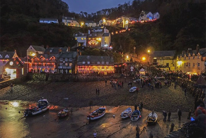 Looking up at Clovelly village at night when it's covered in Christmas lights
