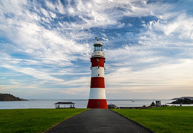 The red and white lighthouse at Plymouth Hoe
