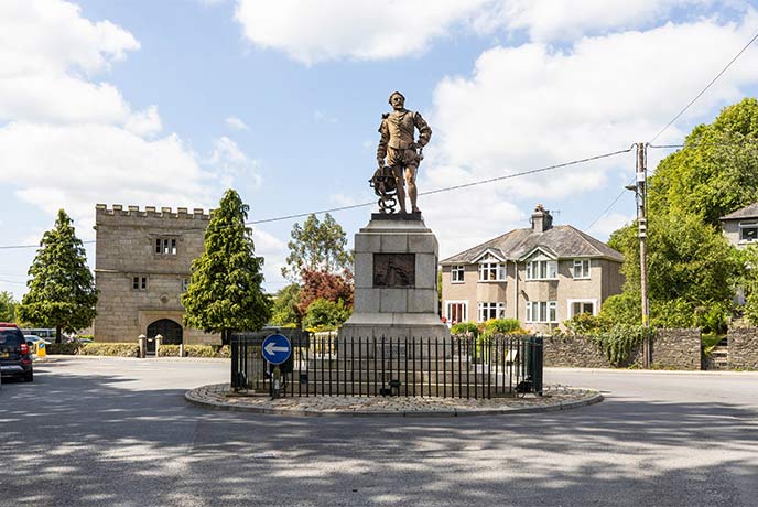 A statue of Sir Francis Drake standing in the middle of the street in Tavistock in Dartmoor National Park