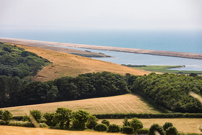 Looking out over fields towards Fleet Lagoon and Chesil beach