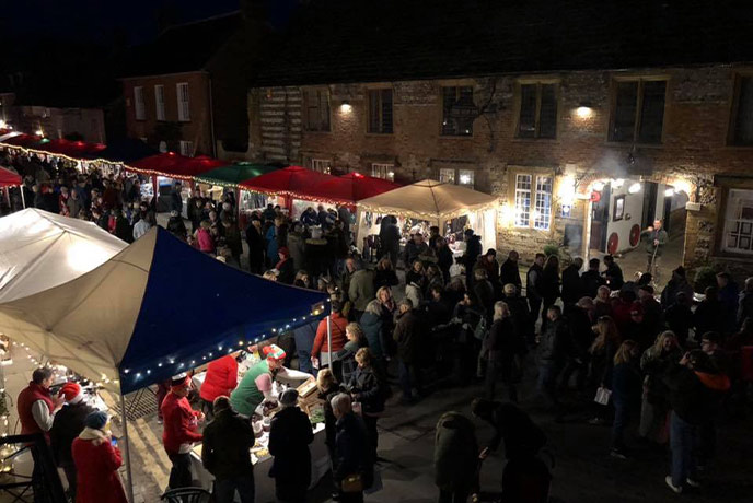 Looking down at the bustling stalls at the Cerne Abbas Christmas Street Fayre