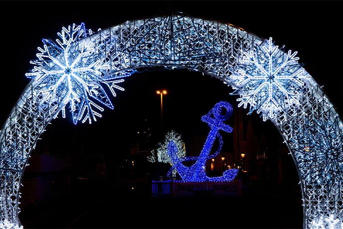An arch and anchor shaped Christmas lights at Poole Christmas Maritime Light Festival in Dorset