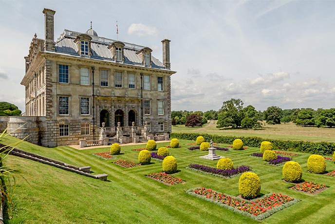 The historic house and manicured garden at Kingston Lacy in Dorset 