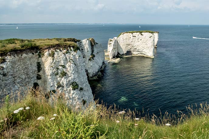 The iconic chalk cliffs and rock formations at Old Harry Rocks on the Dorset coast