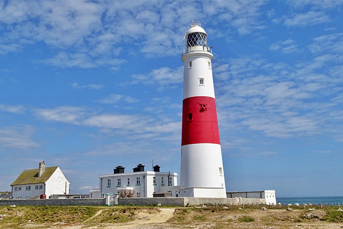 The famous red and white stripes Portland Bill Lighthouse in Dorset