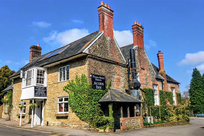 The beautiful stone exterior of The Acorn Inn in Dorset