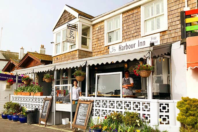 The panelled exterior of The Harbour Inn in Lyme Regis