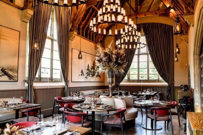 The impressive interior of The Clockspire Restaurant with exposed beams and large chandeliers