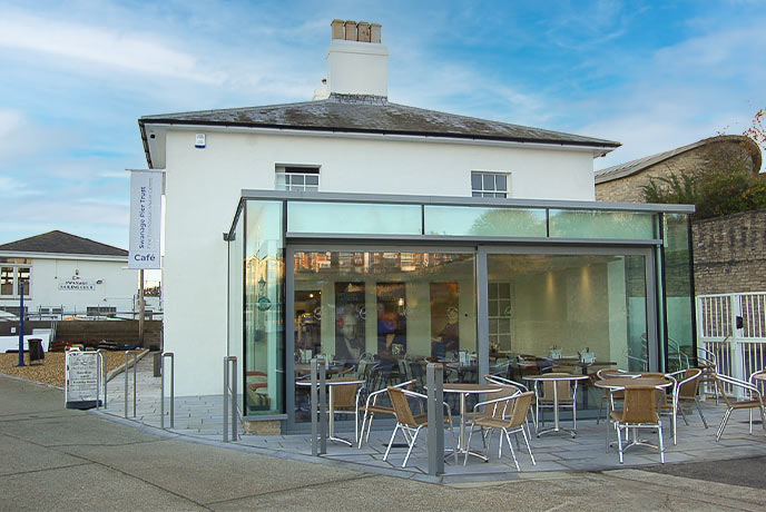 The stone and glass exterior of The 1859 Pier Café & Bistro in Dorset