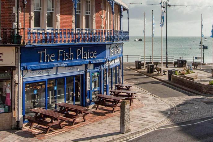 The traditional exterior of The Fish Plaice next to Swanage quay