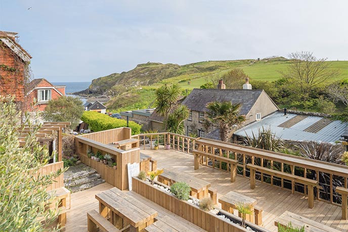 The wooden balcony at Lulworth Lodge Hotel Bistro overlooking the sea