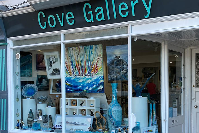 The window of the Cove Gallery in Dorset, full of incredible paintings and sculptures
