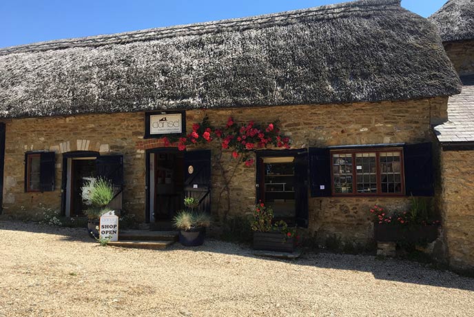 The quaint thatched exterior of Dansel Gallery in Dorset