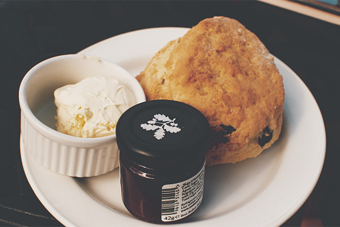 A Devonshire cream tea from the National Trust with a scone, clotted cream and a jar of jam