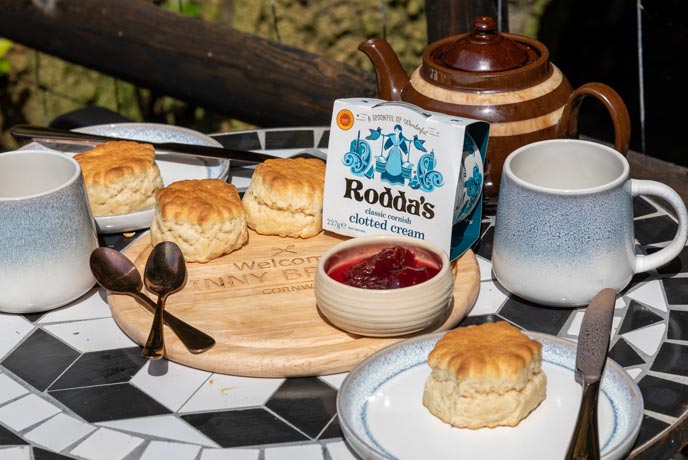 A selection of scones, clotted cream, and jam for a Cornish cream tea