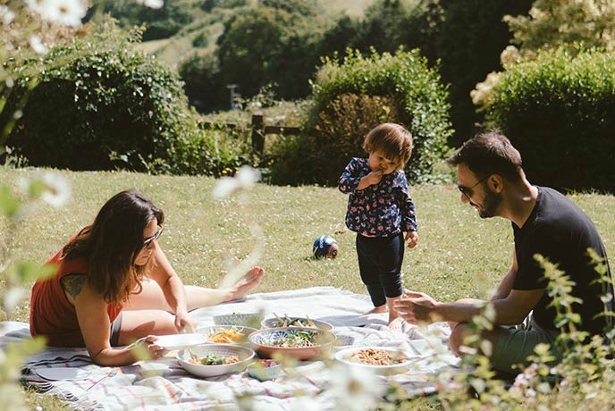 A family having a picnic in a pretty garden