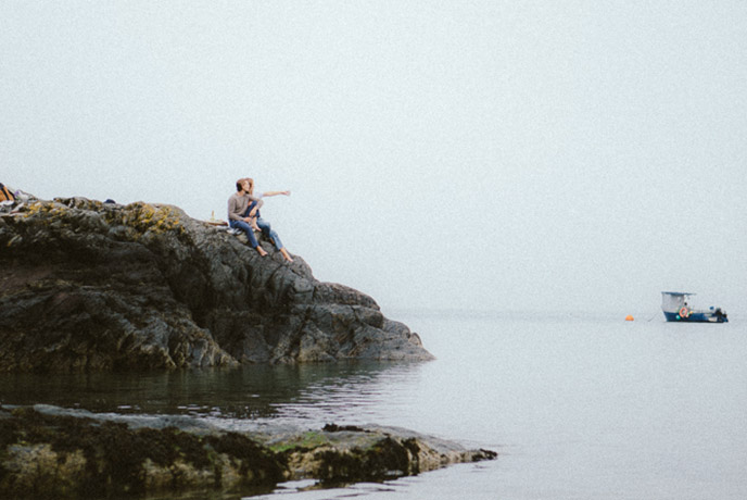 A couple looking out to sea in Pembrokeshire