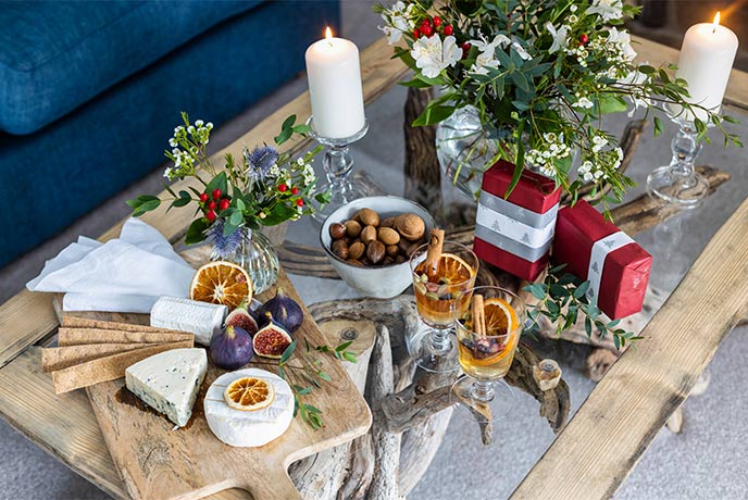 A selection of Christmas food and drink on a coffee table