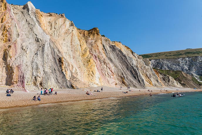 The multicoloured sandstone cliffs at Alum Bay on the Isle of Wight