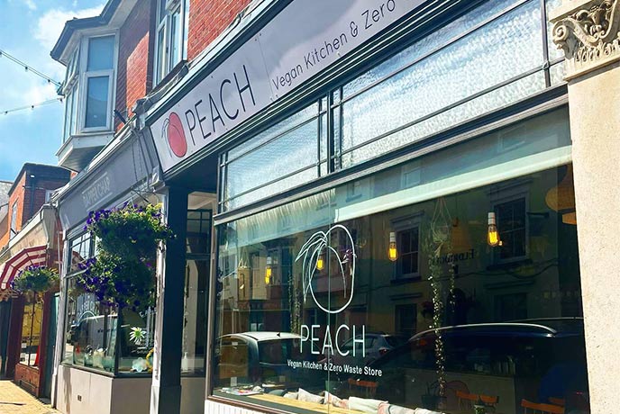 The pretty storefront of Peach, a vegan café on the Isle of Wight