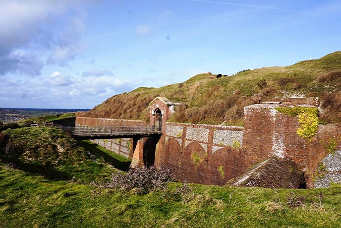 The historic brick of Bembridge Fort, jutting out from the hillside on the Isle of Wight