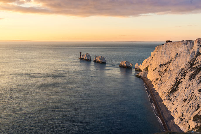 The iconic cliffs at The Needles at sunset on the Isle of Wight