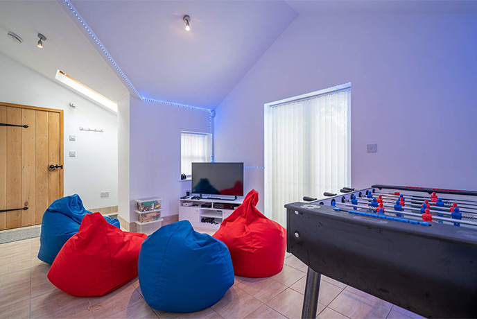 The games room at Harbour View with table football and bean bag chairs
