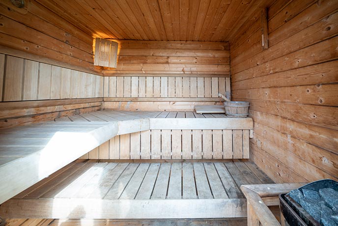 The wooden interior of the sauna at St Andrews holiday cottage on the Isle of Wight