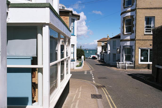 Looking down the street at the sea past Seaview Community Village Shop