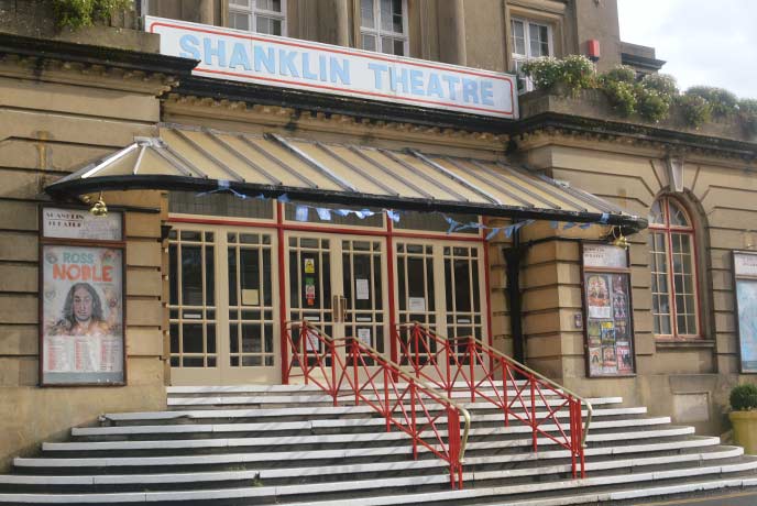 The historic exterior of Shanklin Theatre with steps leading up to the glass front doors