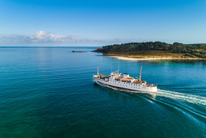 The Scillonian ferry sailing past Halangy Point in the Isles of Scilly