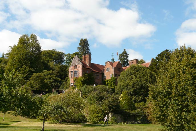 The red-bricked Chartwell House peeking through the trees