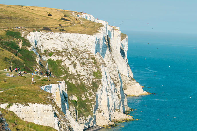 The towering chalk cliffs at the White Cliffs of Dover in Kent