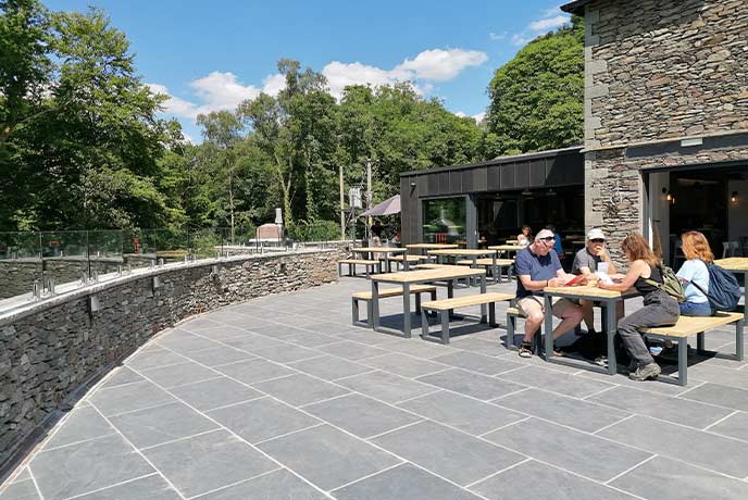 People sitting outside on the terrace at Force Cafe Ambleside