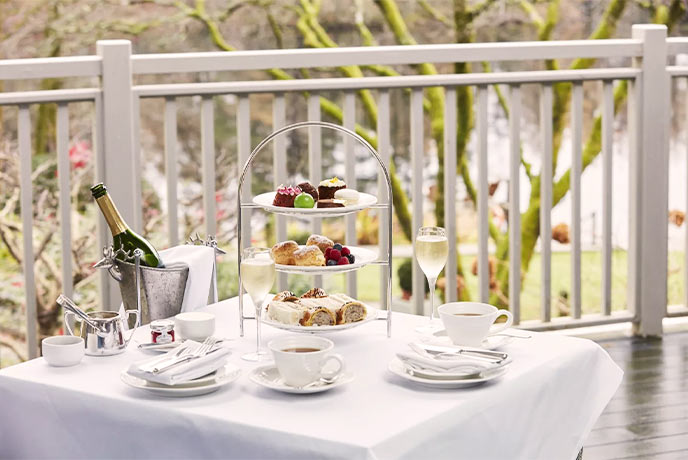 An afternoon tea on a balcony at SOURCE at Gilpin Hotel in the Lake District