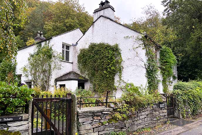 The pretty white exterior of Dove Cottage in the Lake District