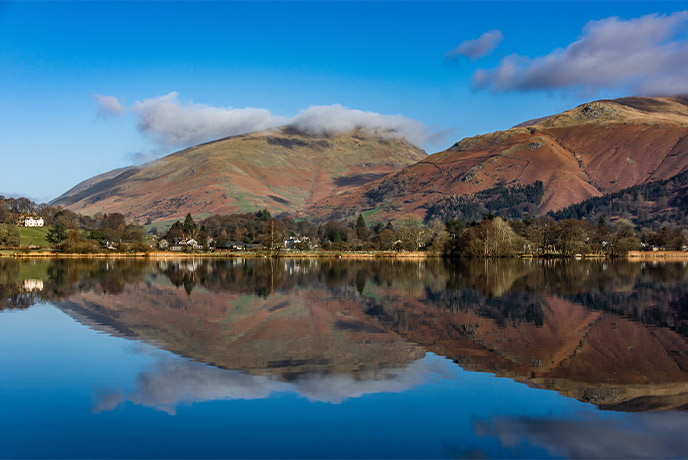 Glassy waters and towering fells in Ambleside