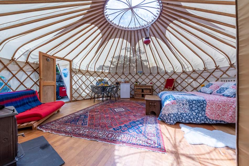 The beautiful interiors of Poppy Yurt glow as the light radiates through the space.