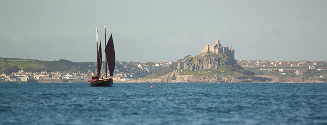 St Michaels Mount and boat view from Mousehole