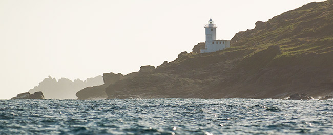 Tater Du lighthouse with Logan Rock coming in to view