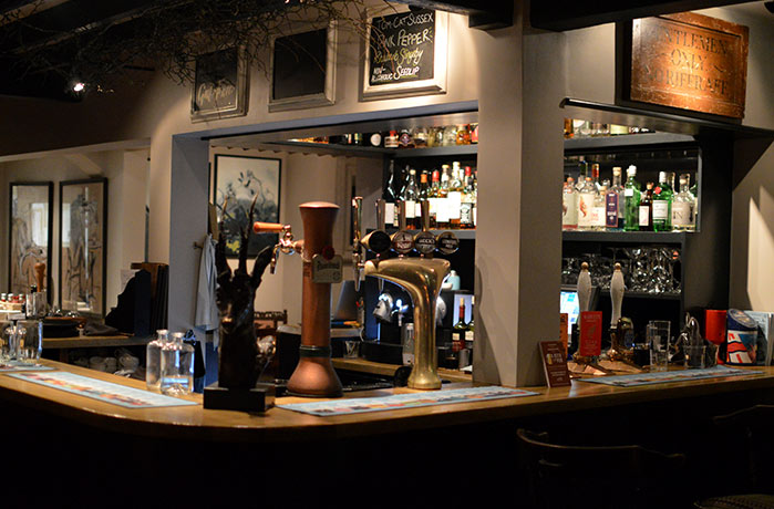 The well-stocked bar at The Hurstwood pub in Sussex.