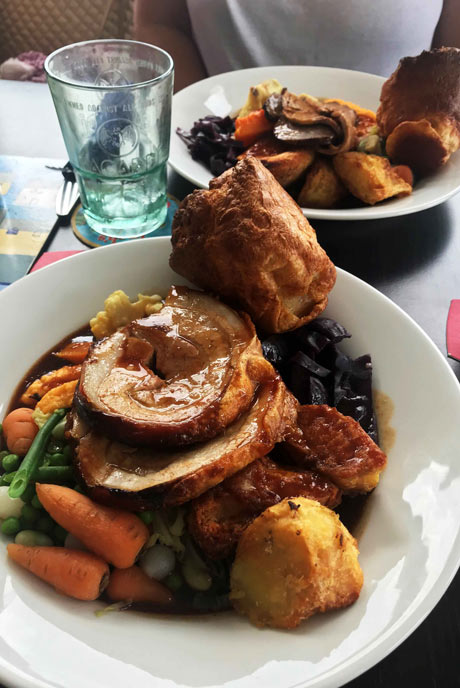 The Boathouse serves up a delectable set of options for roast dinner, including this tasty pork dish with all the trimmings.