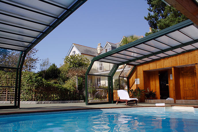 The Garden Apartment shares this heated pool with a retractable roof, along with a hot tub and sauna.