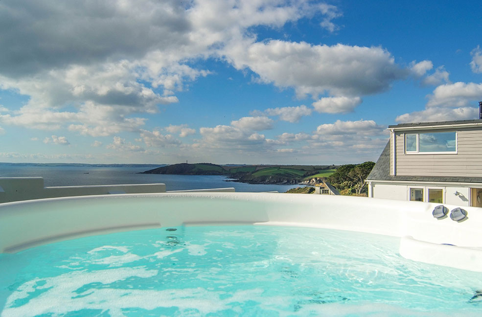 The coastal view from the hot tub at Trelowen.