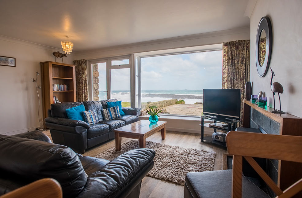 Come rain or shine, we're not sure we'd ever be able to leave the huge picture window at Oystercatcher. Look at the colour of the sea!