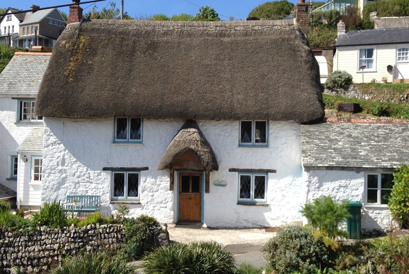 A quaint thatched cottage in one of the most beautiful coves in Cornwall.