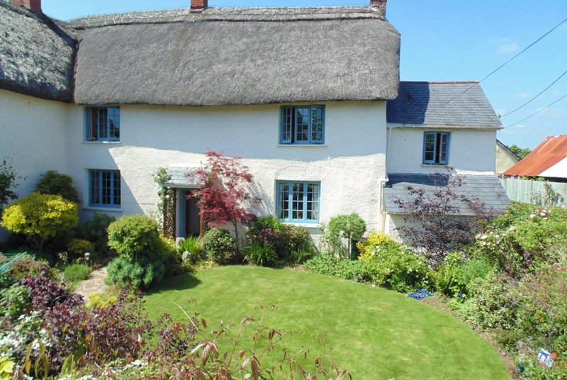 Rustic interiors and a colourful garden make Town Farm House a welcoming place to spend your Devon holiday.